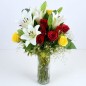 10 red yellow roses n 4 white lilies in a vase